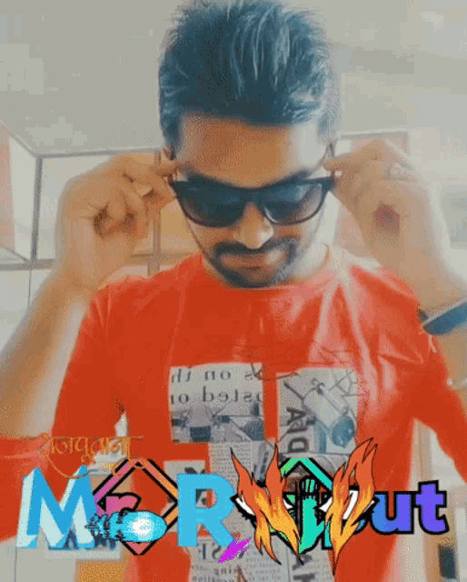 a man wearing sunglasses and a red shirt that says ' moryout ' on it
