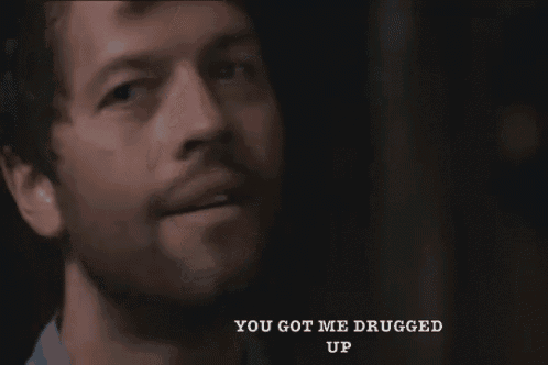 a close up of a man 's face with the words you got me drugged up above him