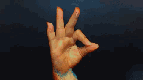 a close up of a person 's hand making a stop gesture