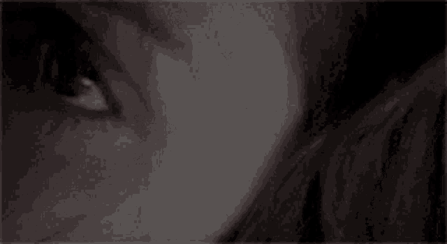 a close up of a woman 's eye with a scar on it .