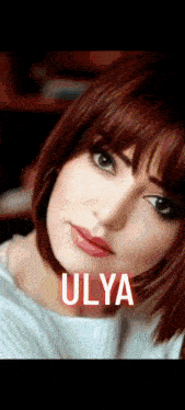 a close up of a woman 's face with the name ulya on the bottom .