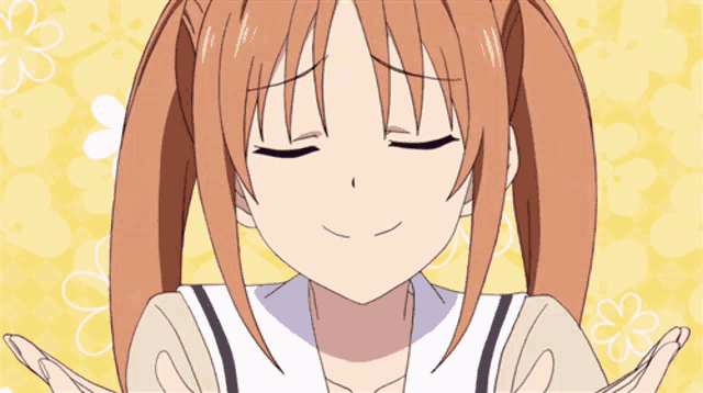 a girl with pigtails is making a face with her mouth open