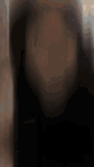 a close up of a woman 's face with the letter a visible