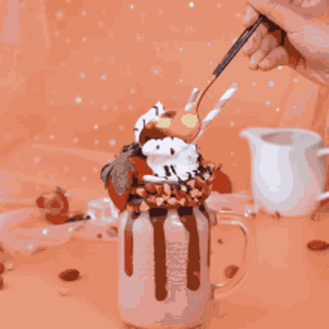 a blue ball is being decorated with chocolate icing