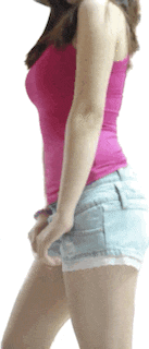 a woman in a pink tank top and blue shorts is standing