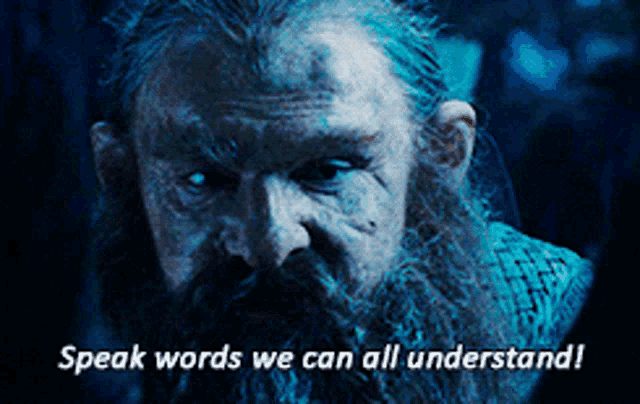 a man with a beard has the words speak words we can all understand
