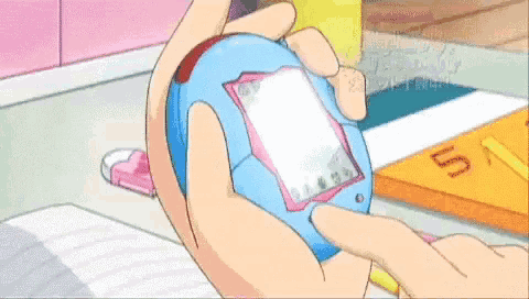 a person is holding a small device with chinese writing on the screen