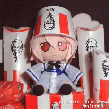a stuffed doll wearing a kfc bucket hat is sitting in a box