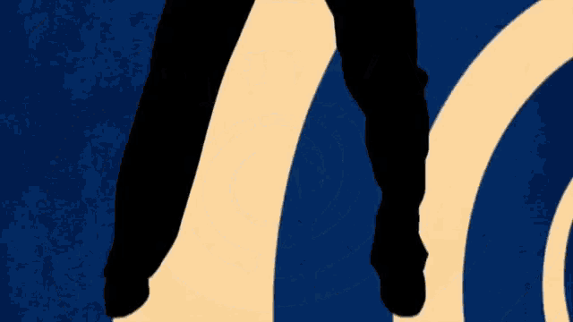 a man in a suit and tie with a knife behind his back