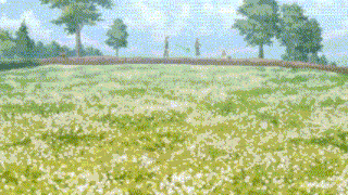a couple standing on top of a grassy hill with trees in the background .