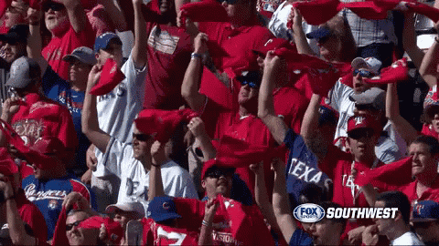 a crowd of people in a stadium with a fox southwest logo