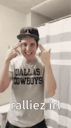 a man wearing a dallas cowboys shirt and hat