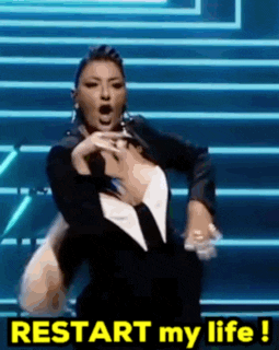 a woman is dancing on a stage with the words restart my life above her .