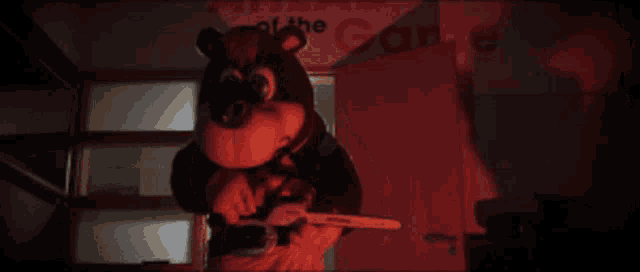 a stuffed animal is holding a chainsaw in front of a sign that says arcade
