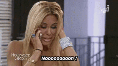 a woman is crying while talking on a cell phone and says noooooon