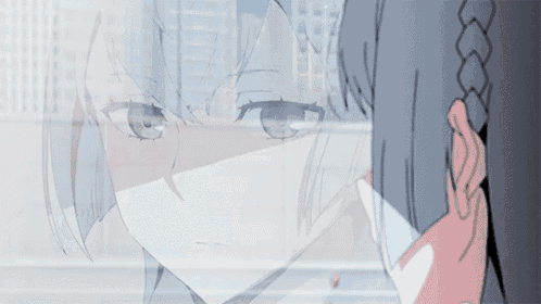 a close up of a girl 's face behind a glass wall