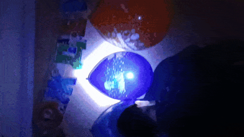 a blue balloon with the number 1 on it is lit up