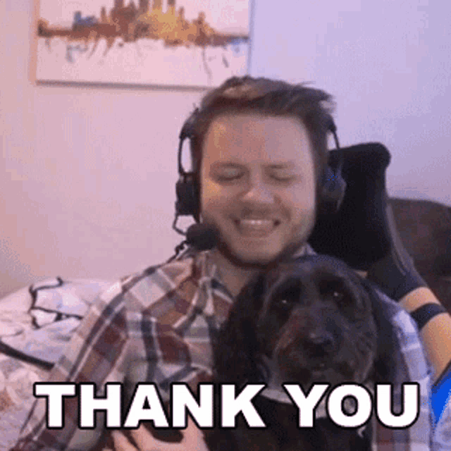 a man wearing headphones is holding a dog with the words thank you written below him