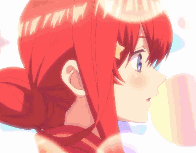 a close up of a girl 's face with red hair and blue eyes