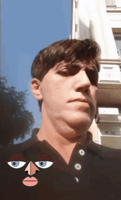 a man wearing a black shirt has a cartoon face on his face