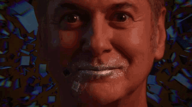 a close up of a man 's face with a smiley face on it