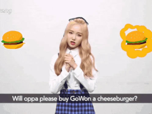 a girl is standing in front of a drawing of a cheeseburger and asking if oppa please buy gowon a cheeseburger