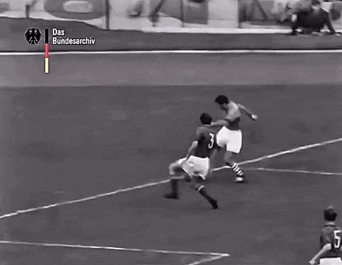 a black and white photo of a soccer game with a youtube logo in the corner