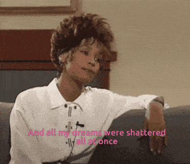 a woman sits on a couch with the words " and all my dreams were shattered all at once "