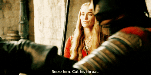 a woman in a red dress is talking to a man in armor who says seize him cut his throat .