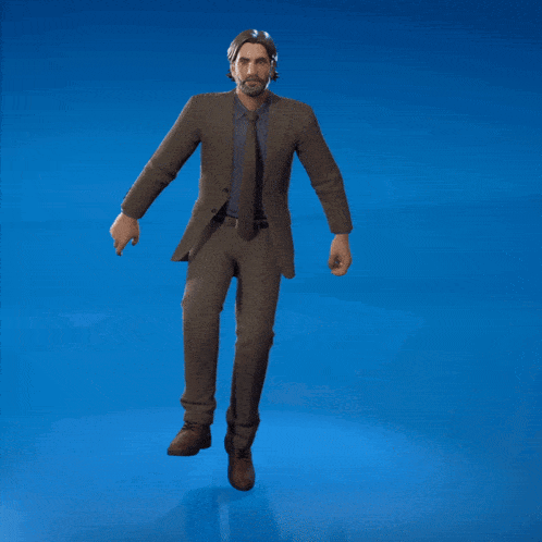 a man in a suit is standing on a blue surface