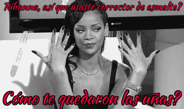 a black and white photo of a woman with black nails and the caption rihanna así que usaste corrector de esmalte
