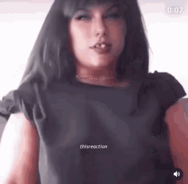 a close up of a woman 's face with the words thisreaction at the bottom .