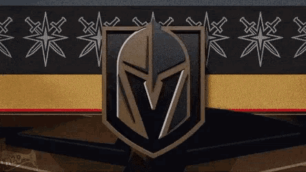 a knight 's helmet is in the center of a shield with the letter v on it