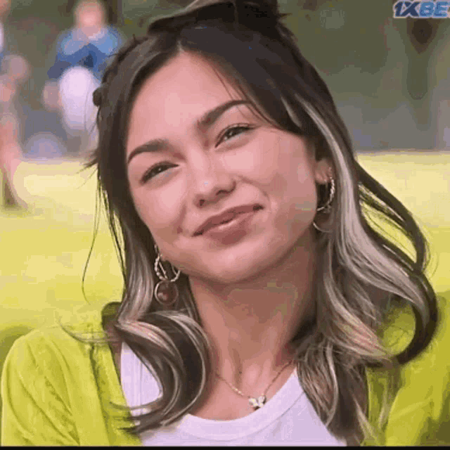 a close up of a woman 's face with the words 1xbet on the bottom right
