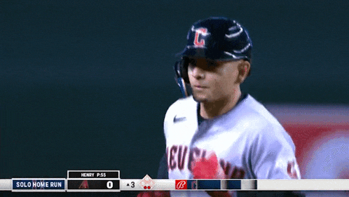 a baseball player wearing a jersey that says cleveland on it