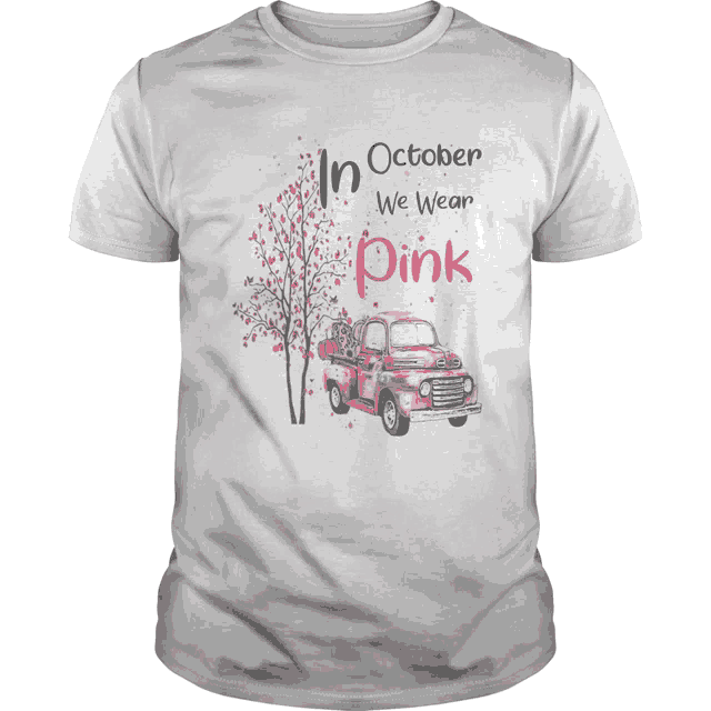 a shirt that says in october we wear pink with a red truck