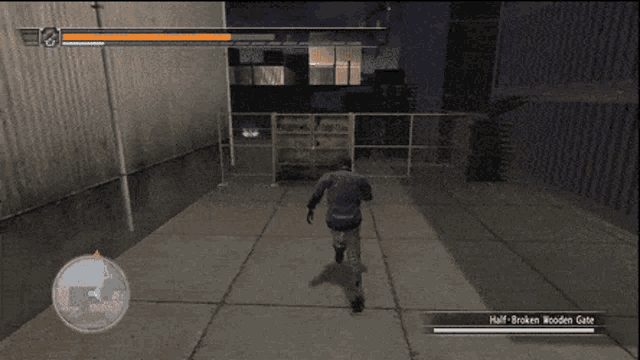 a video game screen shows a man standing in front of a fence and a half broken wooden gate