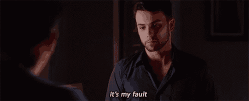 a man with a beard is talking to another man and saying it 's my fault .