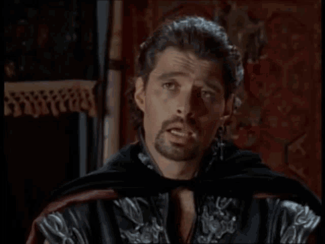a man in a black cape says " no that 's not the problem "