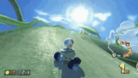 a video game screen shows a toad going up a hill with a 1st place sign