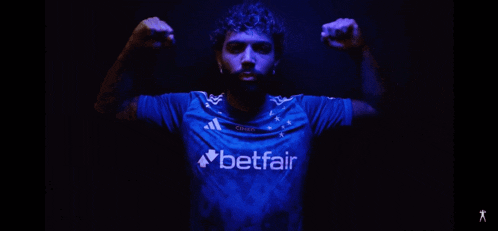 a man in a blue shirt that says betfair