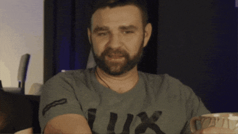 a man with a beard wears a shirt that says lux