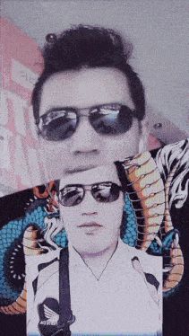 a picture of a man wearing sunglasses and a shirt that says honda