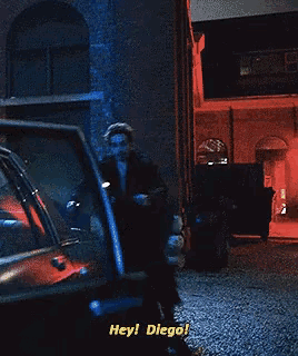 a man getting out of a car with the words hey diego on the bottom