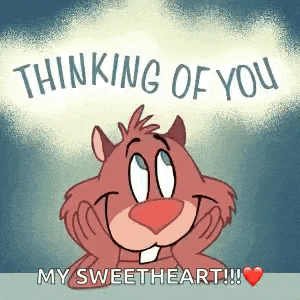 a cartoon beaver is smiling with his hands on his face and says `` thinking of you my sweetheart '' .