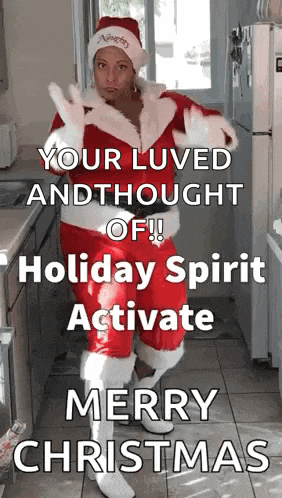 a woman dressed as santa claus is standing in a kitchen with a christmas message