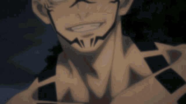 a close up of a man 's face with a tattoo on his chest