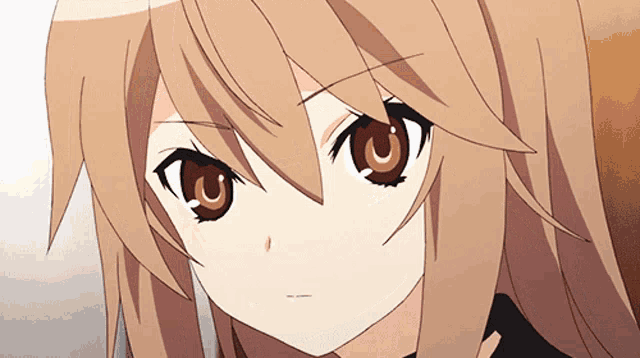 a close up of a girl 's face with a u in her eye