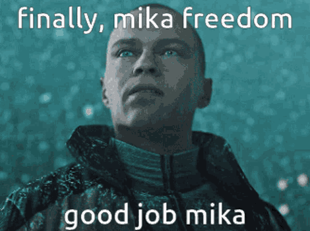 a man in a jacket with the words finally mika freedom good job mika above him