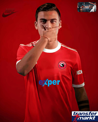 a soccer player wearing a red jersey with the word expert on it